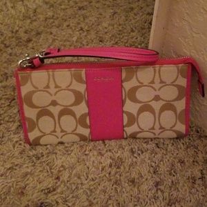 Coach brown and raspberry wristlet
